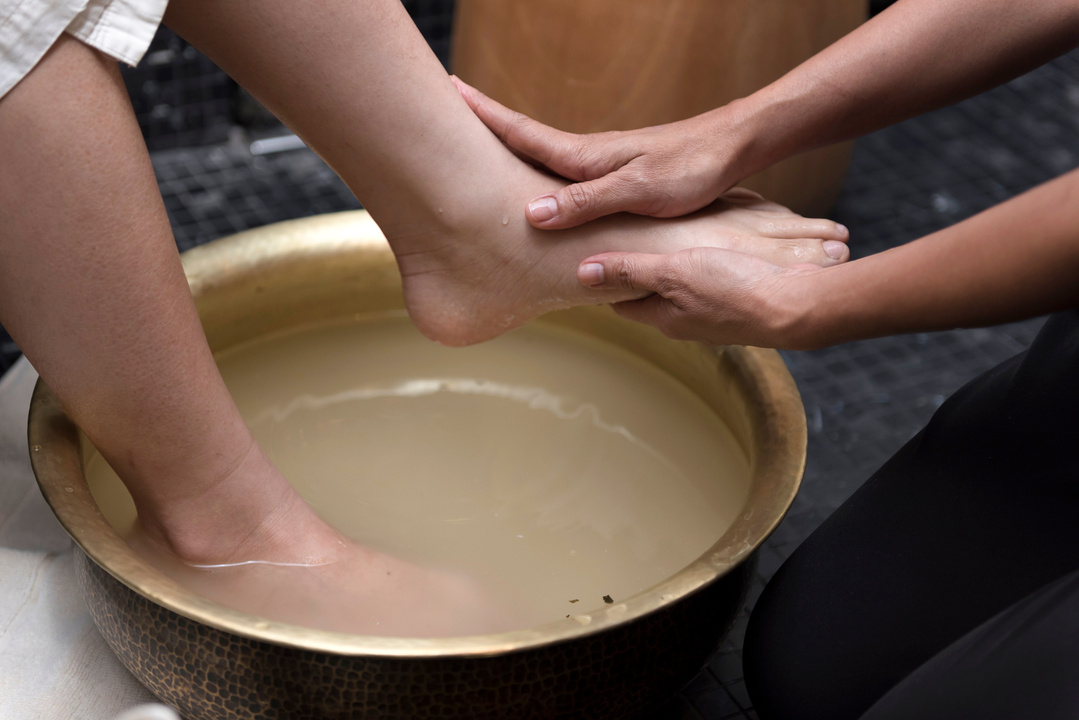 Foot washing in spa before treatment